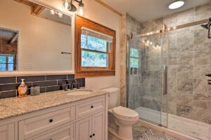 Modern vacation cabin bath of granite and tile, very clean and comfortable