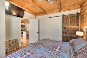 NC vacation cabin master king bedroom with farm closet door